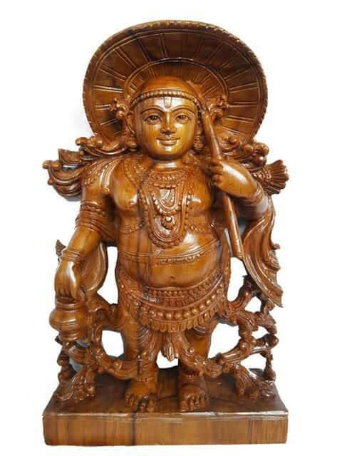Handcarved wooden deity sculpture
