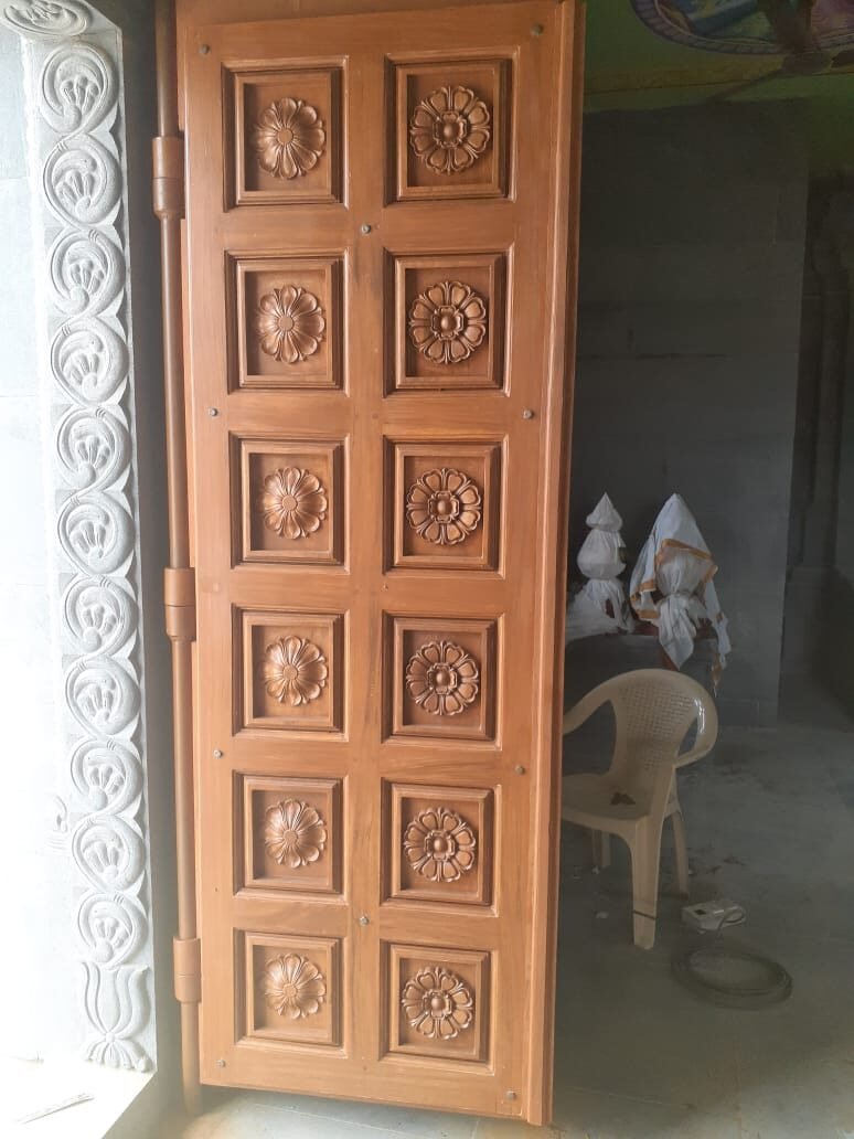 Carved wooden entrance door for a hotel lobby