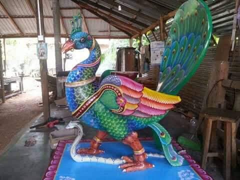Colourful painted peacock vahanam sculpture